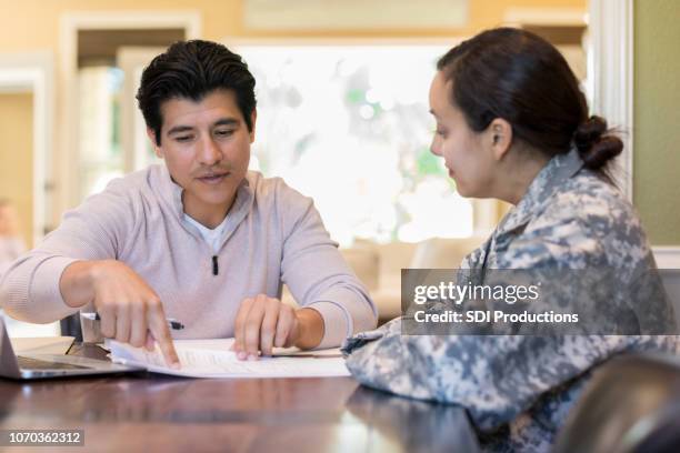 couple review legal documents - military home stock pictures, royalty-free photos & images