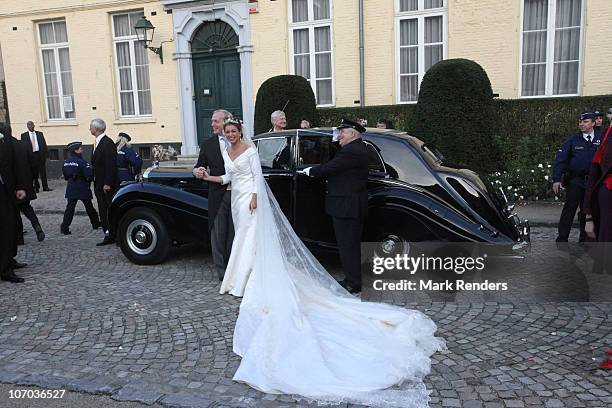 Princess Annemarie Gualtherie van Weezel and Prince Carlos de Bourbon de Parme pose for a photo in front of their car during their Royal Wedding at...