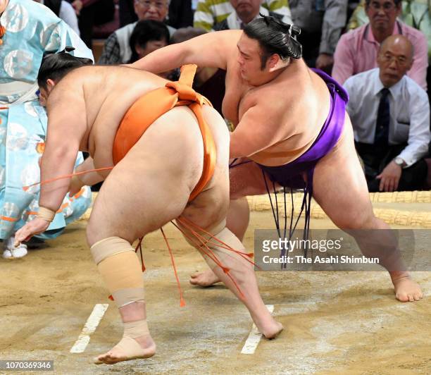 Komusubi Takakeisho throws Brazilian wrestler Kaisei to win on day six of the Grand Sumo Kyushu Tournament at Fukuoka Convention Center on November...