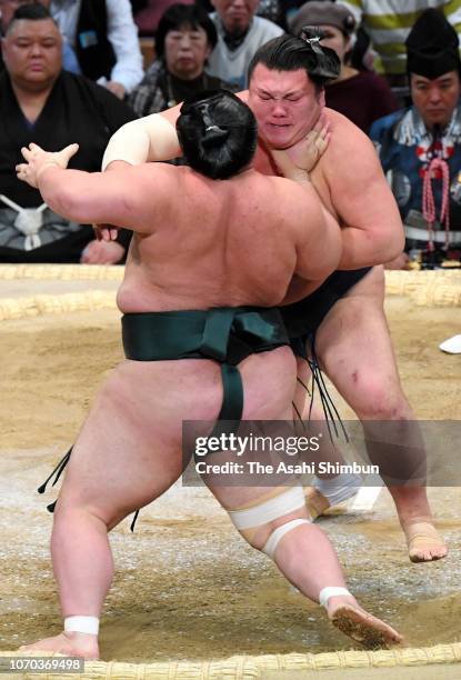 Ikioi pushes Yutakayama out of the ring on day six of the Grand Sumo Kyushu Tournament at Fukuoka Convention Center on November 16, 2018 in Fukuoka,...