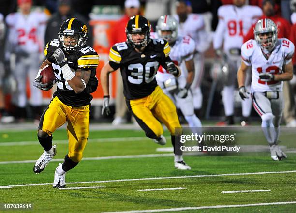 Defensive back Shaun Prater of the University of Iowa Hawkeyes returns a pass interception against the Ohio State Buckeyes during the second half of...