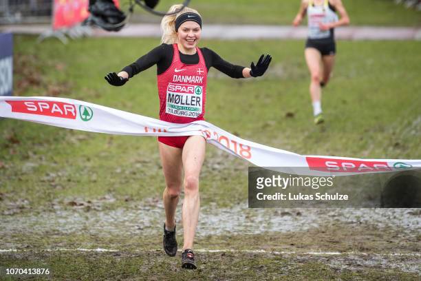 Anna Emilie Moeller of Denmark celebrates during the U23 Women race of the SPAR European Cross Country Championships on December 9, 2018 in Tilburg,...