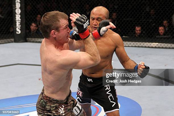 Penn knocks down Matt Hughes in the first round during their Welterweight bout part of UFC 123 at the Palace of Auburn Hills on November 20, 2010 in...