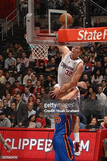Blake Griffin of the Los Angeles Clippers goes up for a dunk against Timofey Mozgov of the New York Knicks at Staples Center on November 20, 2010 in...