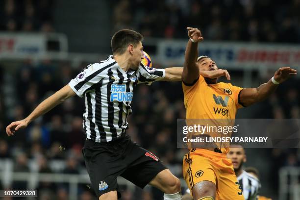 Newcastle United's Argentinian defender Federico Fernandez (L0 vies with Wolverhampton Wanderers' Spanish striker Adama Traore during the English...