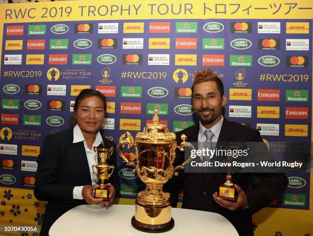 Womens player of the year Srijana Rai and Mens player of the year Birat Shrestha pose with the Webb Ellis Cup during the gala dinner held as part of...