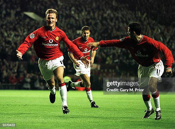 Teddy Sheringham of Man Utd celebrates after scoring the first goal during the Manchester United v PSV Eindhoven UEFA Champions League Group G match...