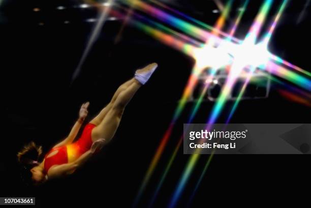He Wenna of China competes in the Women's Individual Qualification of trampoline gymnastics at Asian Games Town Gymnasium during day nine of the 16th...
