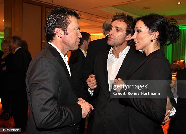 Thomas Doll of the DFV Legend and his wife Biljana have a chat with Lothar Matthaeus of the World Champion 1990 during the Players Night at the...