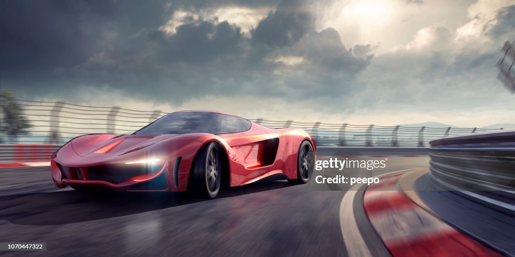 Generic Red Sports Car Cornering Around Bend In Racetrack