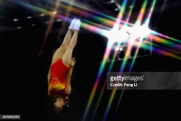 He Wenna of China competes in the Women's Individual Qualification of trampoline gymnastics at Asian Games Town Gymnasium during day nine of the 16th...