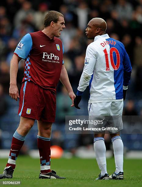 El Hadji Diouf of Blackburn Rovers and Richard Dunne of Aston Villa exchange views during the Barclays Premier League match between Blackburn Rovers...