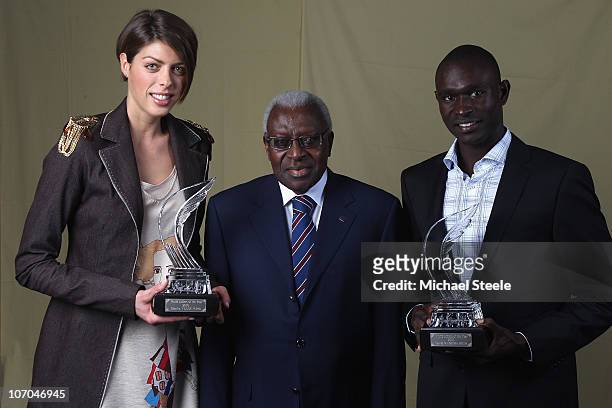 Iaaf President Mr.Lamine Diack poses with Blanka Vlasic of Croatia and David Rudisha of Kenya as they receive the athletes of the year award during...