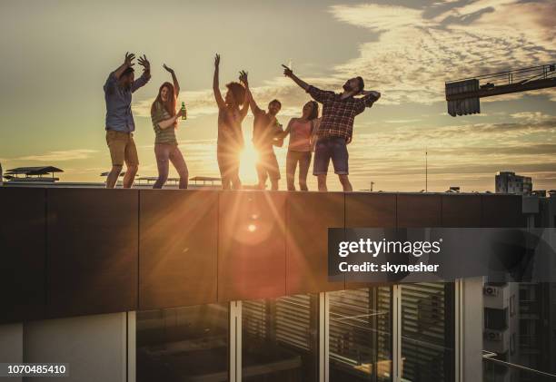dancing on a rooftop party! - penthouses party stock pictures, royalty-free photos & images