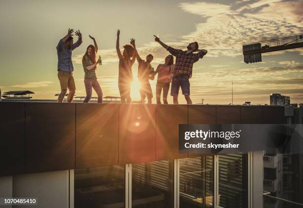 dancing on a rooftop party! - rooftop party stock pictures, royalty-free photos & images