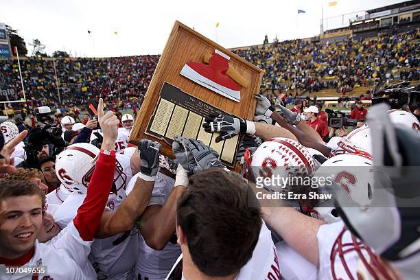 The Stanford Cardinal celebrate with "The Axe" after beating the California Golden Bears at California Memorial Stadium on November 20, 2010 in...