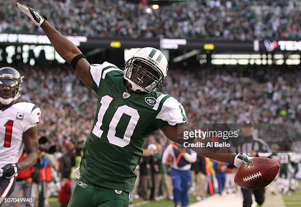 Santonio Holmes of the New York Jets scores a touchdown against the Houston Texans during the third quarter of their game on November 21, 2010 at the...