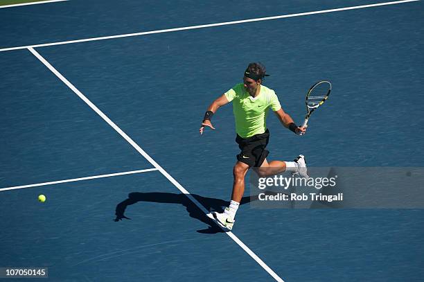 Rafael Nadal prepares to hit a return to Mikhail Youzhny on day thirteen of the 2010 U.S. Open at the USTA Billie Jean King National Tennis Center on...