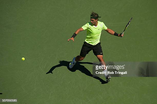 Rafael Nadal prepares to hit a return to Mikhail Youzhny on day thirteen of the 2010 U.S. Open at the USTA Billie Jean King National Tennis Center on...
