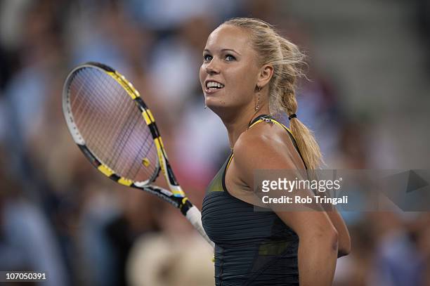 Caroline Wozniacki looks on after defeating Dominika Cibulkova on day ten of the 2010 U.S. Open at the USTA Billie Jean King National Tennis Center...