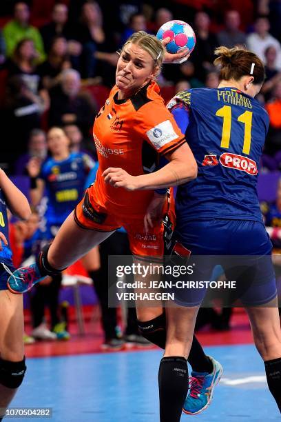 Netherlands' left back Jessy Kramer shoots past a Romanian defender during the Euro 2018 European Women's Handball Championship Group 2 main round...