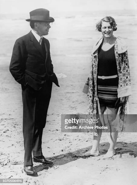 Canadian-British newspaper publisher and politician Max Aitken, 1st Baron Beaverbrook chatting with Vera Edyth Griffith-Boscawen, Lady Broughton on a...