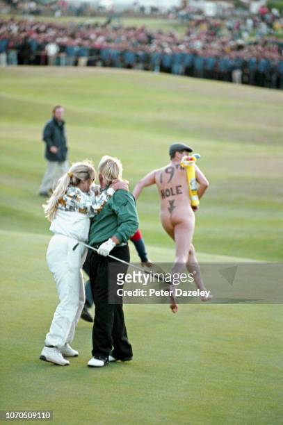 Streaker runs onto the 18th green as John Daly and his wife Paulette celebrate after Daly beat Costantino Rocca of Italy in a play-off to take the...
