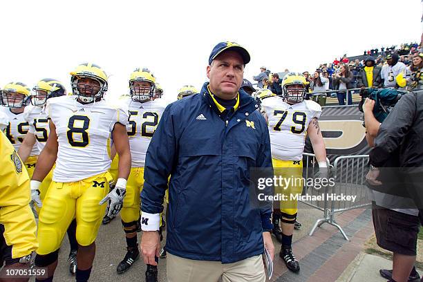 Rich Rodriguez head coach of the Michigan Wolverines prepares to lead the team on the field before action against the Purdue Boilermakers November...