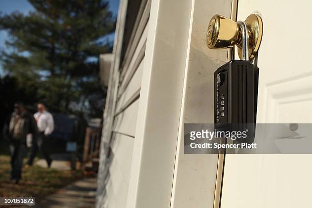 The front door with a lock is seen in a foreclosed house November 21, 2010 in Ansonia, Connecticut. The home was one of numerous foreclosed homes on...