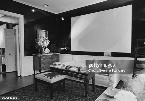 View on one of the rooms of David Nightingale Hicks's London home, UK, 20th October 1966; on the wall on the right a a yellow and white abstract...