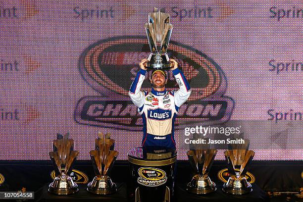 Jimmie Johnson, driver of the Lowe's Chevrolet, celebrates after finishing in second place in the Ford 400 to clinch his fifth consecutive NASCAR...