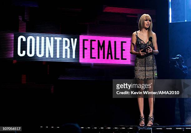 Musician Taylor Swift accepts the Best Country Female award onstage during the 2010 American Music Awards held at Nokia Theatre L.A. Live on November...
