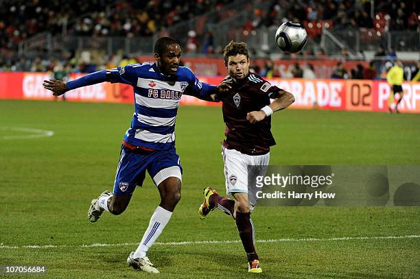 Drew Moor of the Colorado Rapids fights for possession of the ball against Atiba Harris of FC Dallas during the first half of the 2010 MLS Cup match...