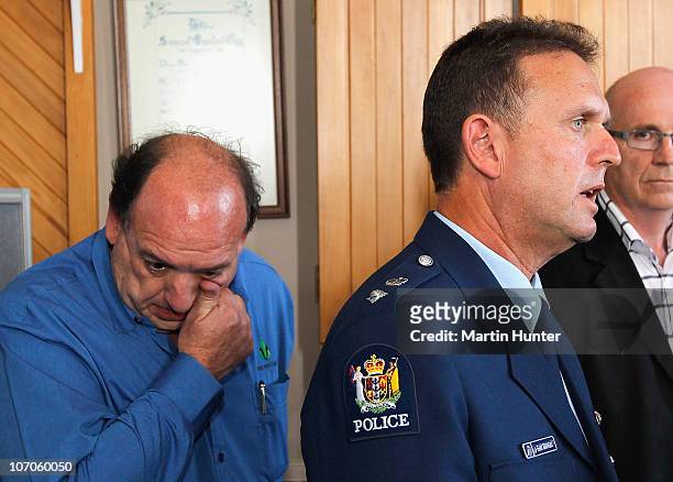 Police Superintendent Gary Knowles speaks to the media while CEO of Pike River Coal Mine Peter Whittall wipes his tears during a press conference on...