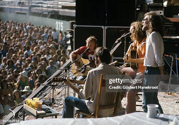 Crosby, Stills, Nash And Young, L-R Stephen Stills, Neil Young, David Crosby, Graham Nash, perform live on stage at Oakland Stadium, California...