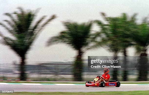 Michael Schumacher of Germany and Ferrari in action on the Sepang go cart circuit prior to the Malaysian Formula One Grand Prix at the Sepang...