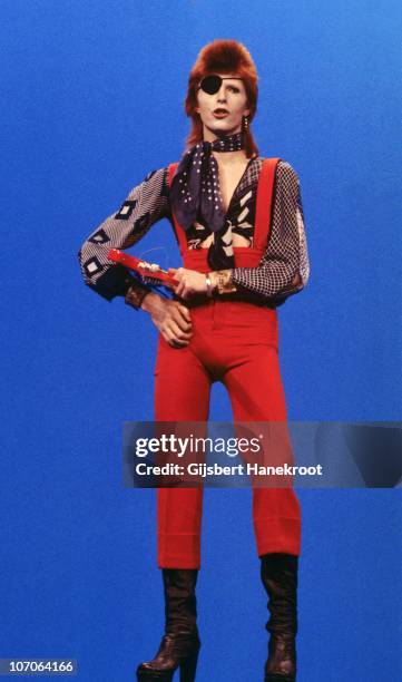 Full length portrait of David Bowie performing on the Dutch TV show TopPop playing the song 'Rebel Rebel' and wearing an eye patch on 7th February...