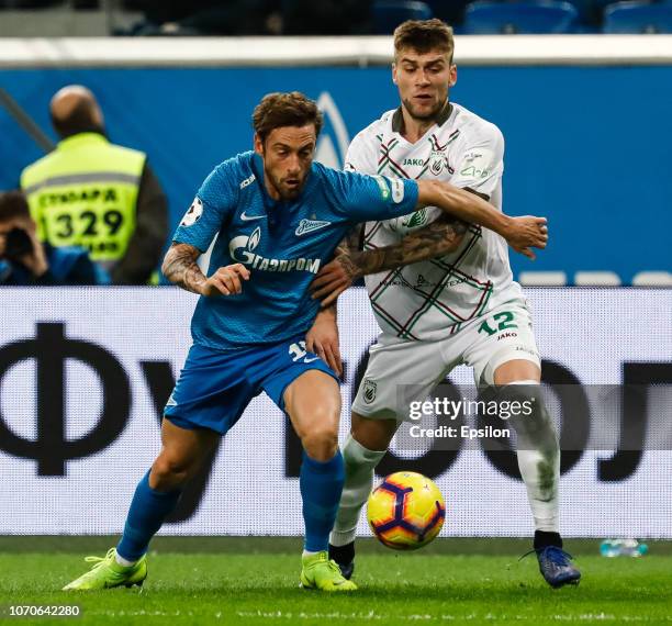 Claudio Marchisio of FC Zenit Saint Petersburg and Igor Kalinin of FC Rubin Kazan vie for the ball during the Russian Premier League match between FC...