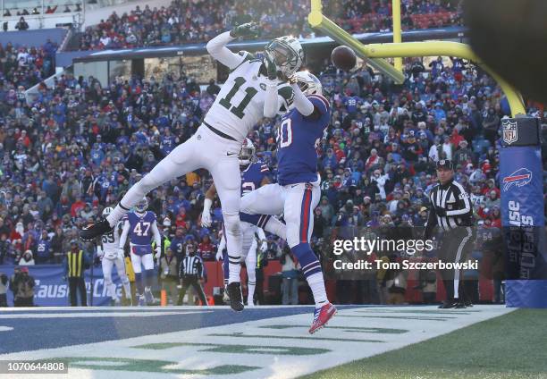 Robby Anderson of the New York Jets cannot hang on to a pass in the end zone in the second quarter during NFL game action as Rafael Bush of the...