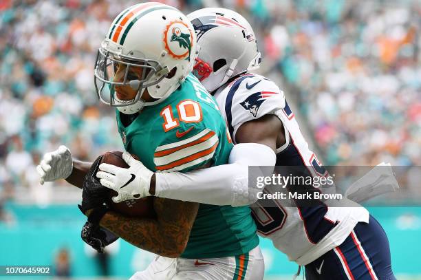 Kenny Stills of the Miami Dolphins scores a touchdown in the first quarter against the New England Patriots at Hard Rock Stadium on December 9, 2018...