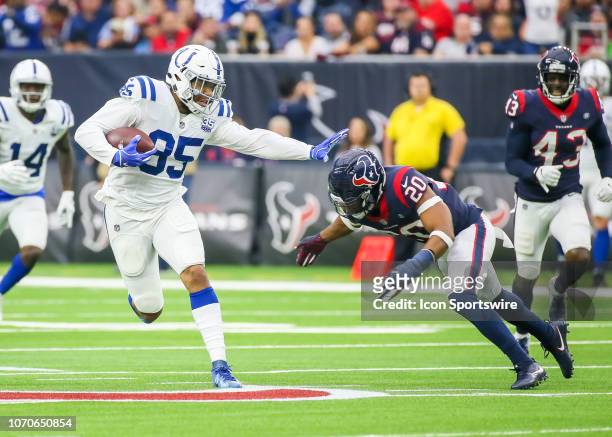 Indianapolis Colts tight end Eric Ebron tries to push off Houston Texans strong safety Justin Reid during the football game between the Indianapolis...