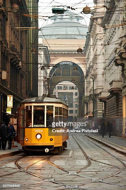 tram and galleria vittorio in milan, italy - galleria vittorio emanuele ii stock pictures, royalty-free photos & images