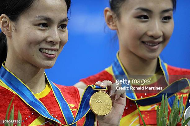 Shanshan Huang and Wenna He of China pose with their medals in the Women's Individual final of trampoline gymnastics at Asian Games Town Gymnasium on...