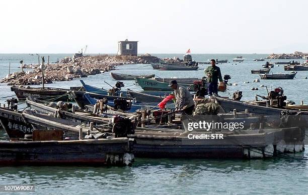 China-Asia-military-maritime-dispute,FOCUS by Pascale Trouillaud This photo taken on October 28, 2010 shows fishing boats docked at a fishing village...