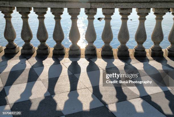 terrace with balustrade overlooking the sea in livorno, italy - balustrade stock pictures, royalty-free photos & images