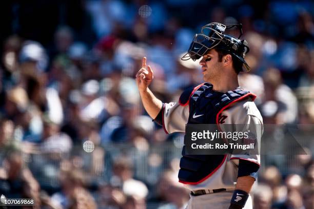 Joe Mauer of the Minnesota Twins talks with his teammates during the game against the New York Yankees at Yankee Stadium on May 16, 2010 in the Bronx...