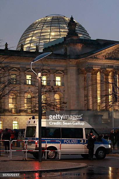 German police van blocks access to the perimeter of the Reichstag, seat of the Bundestag, or German parliament, on November 22, 2010 in Berlin,...