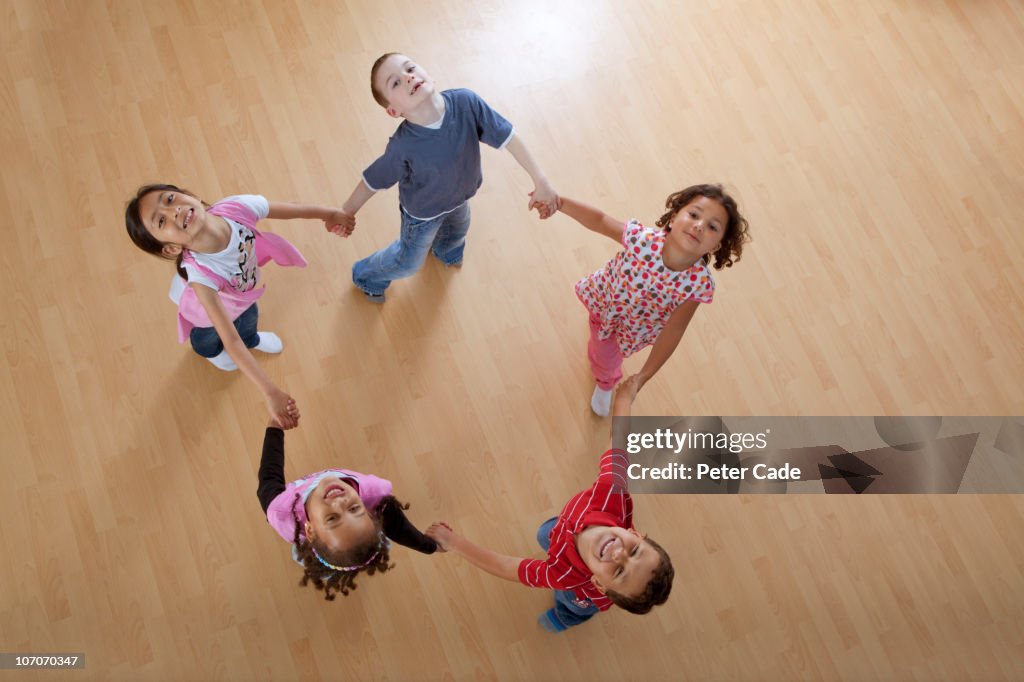 Children skipping aroung in a circle