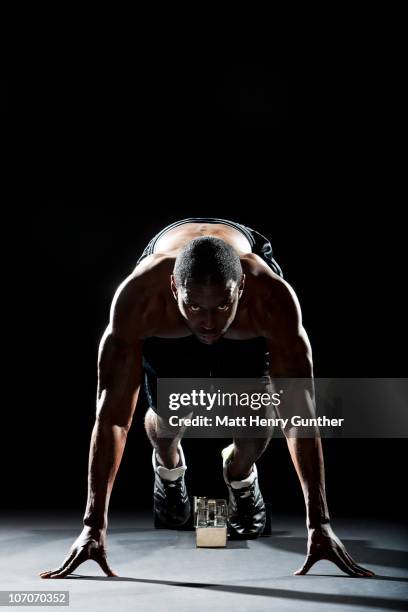 male sprinter in starting position - athlete sprint stock pictures, royalty-free photos & images