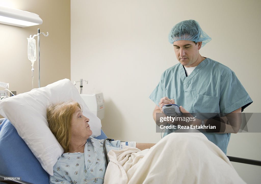 Surgeon talks to patient